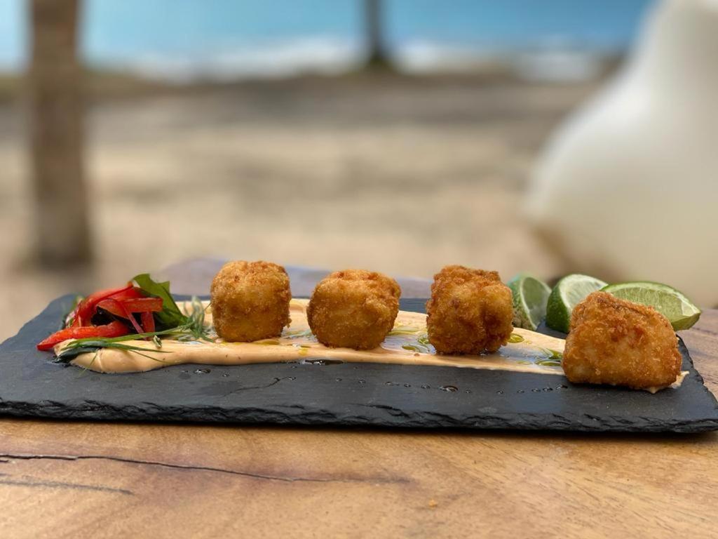 Café de Playa beach front suites Coco Esterno foto